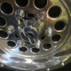 Pull the pin and the wheel comes right off. The lug nuts are fake, sorry.